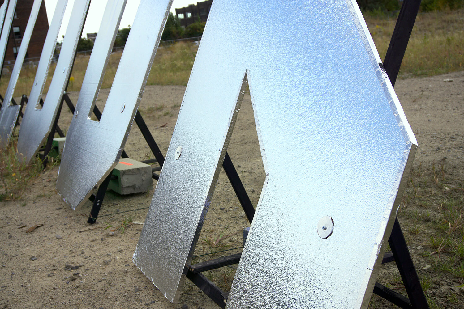 7FT silver letters that read Made you look behind the Museum of Contemporary Arts